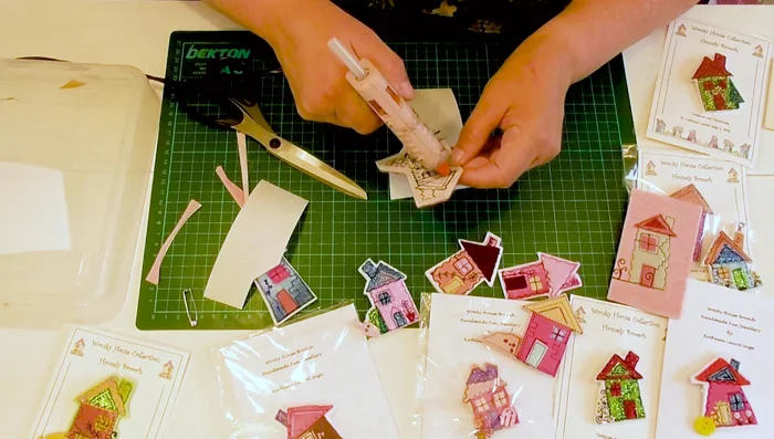 Attach the felt house to the brooch base.