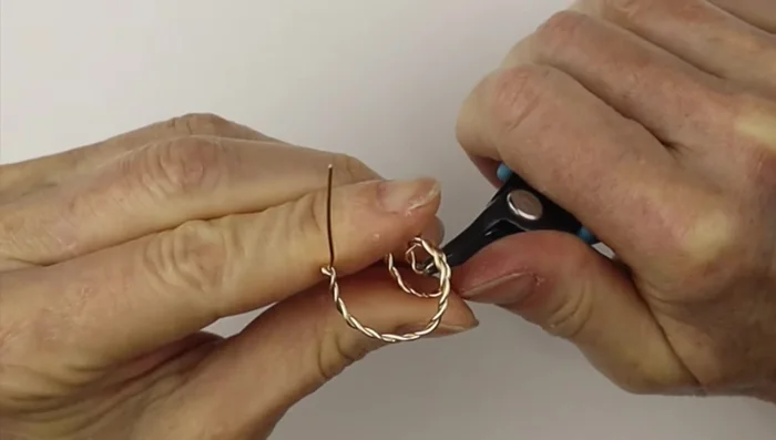 Optional: Gently hammer the spirals to flatten and solidify them.