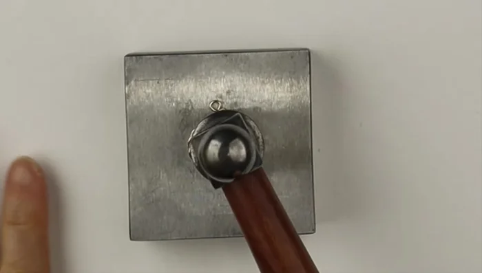 Optional: Gently hammer the spirals to flatten and solidify them.