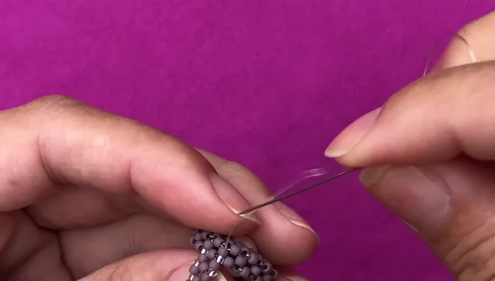 Add bottom embellishment (optional): Add more size 15/0 seed beads to the bottom of the ring for extra detail. 