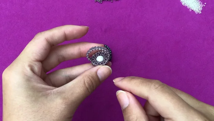 Finish: Secure the thread with knots and trim excess.