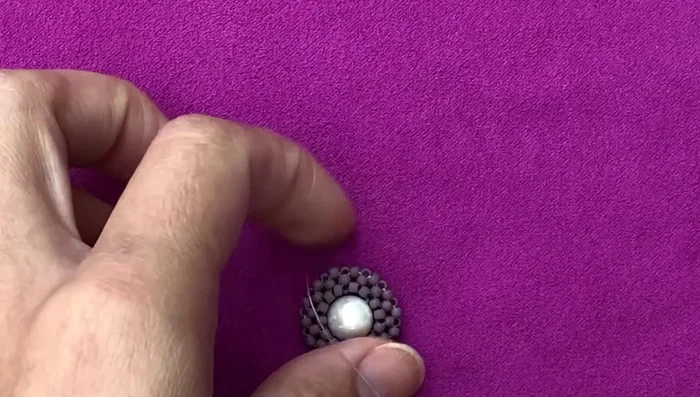 Create the ring band: This uses a right-angle weave technique, constructing squares of beads.