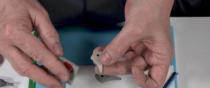 Drill holes in the earrings using a setting bur.