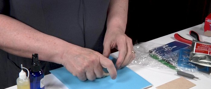 Roll out the clay to desired thickness using four cards.