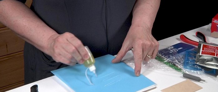 Roll out the clay to desired thickness using four cards.