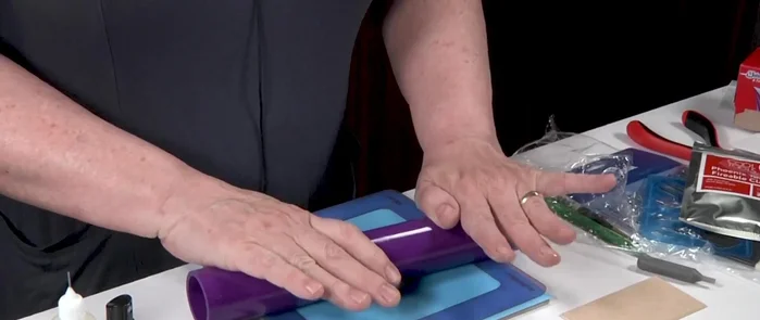 Roll out the clay to desired thickness using four cards.