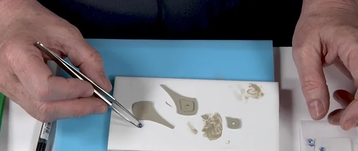 Set the nano gems into their bezels.