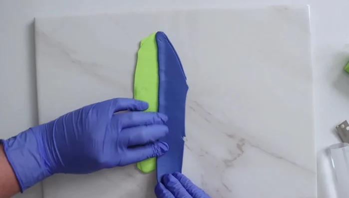 Use an acrylic roller to blend the strips together a few times.