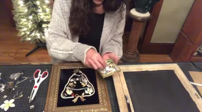 Fill in gaps: Add smaller jewelry pieces, beads, and other embellishments to fill the gaps and create a fuller tree shape.