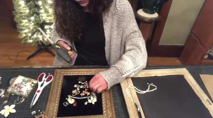 Finalize the tree: Add finishing touches such as pearls or sequins to enhance the design. Remove any excess strings or jewelry pieces.