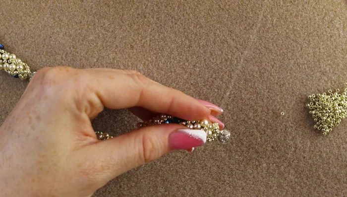 Finish: Weave the thread through the beads to finish, cut and secure the thread.