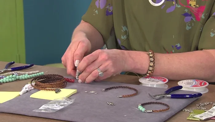 Thread the stretchy cord through the beads twice.