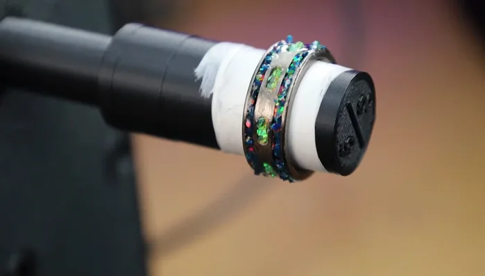 Flood the entire inlay area with CA glue and let it spin on the slow turner to evenly coat, or use an accelerator to speed up the process.