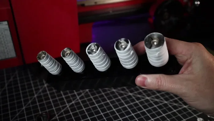 Clean up the ring using a mini lathe, expandable steel mandrels (wrapped in Teflon tape), and various grits of sandpaper (wet sanding recommended).