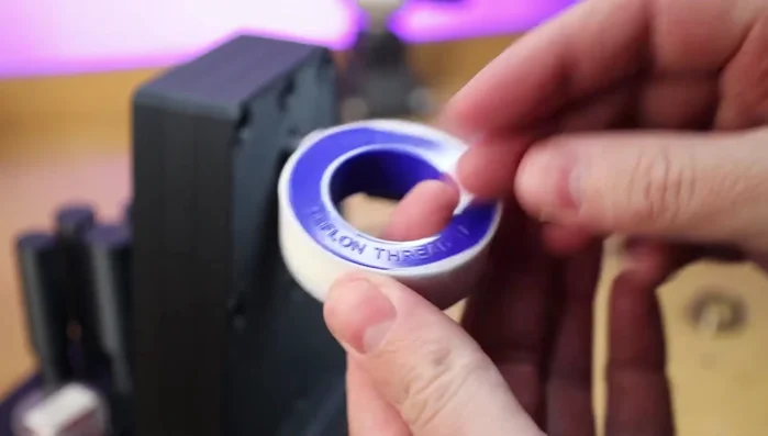 Prepare the ring mandrel by adding Teflon tape to ensure the ring can be easily removed after gluing.