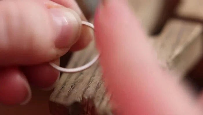 Sand off excess solder around the joint using files and polishing sticks.