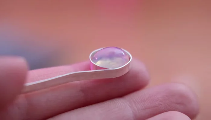 Wrap the bezel wire around the gemstone, cut, and check the size. Use half-round pliers to shape.