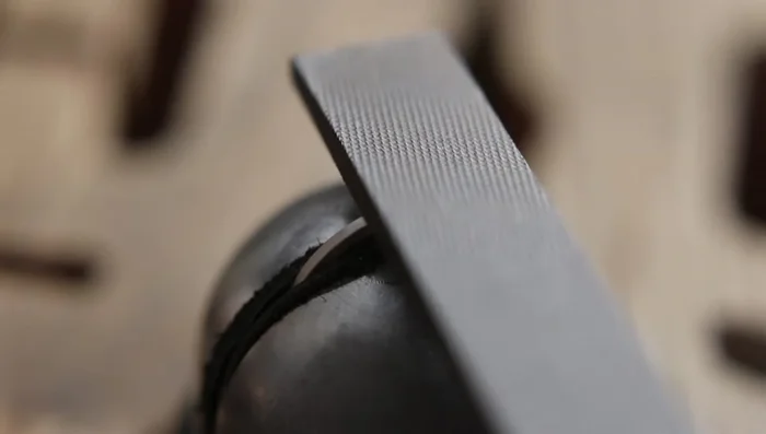 Solder the bezel to the ring band using hard solder paste. Heat tweezers first to avoid heat sink.