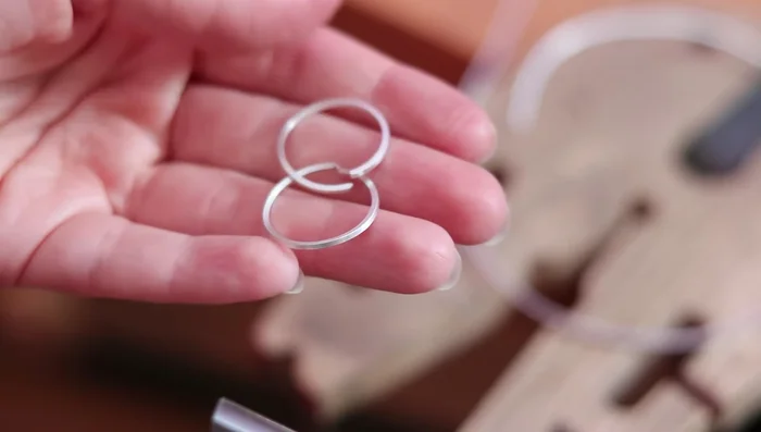 Cut and adjust the ring bands to the desired size. Use a mallet to even out any twists.