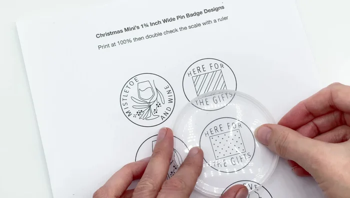 Apply glue stick to one side of the plastic circle and adhere it to the back felt (with the pin already attached).