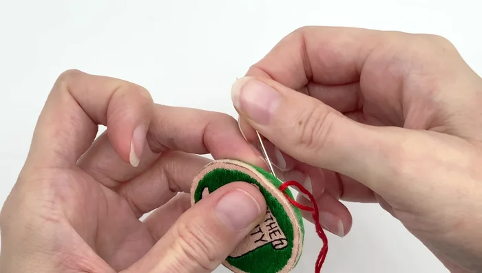 Secure the thread with a knot between the felt layers at the beginning and end.