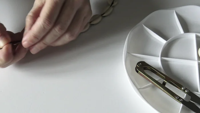 Add the final wooden bead: Attach a wooden bead to the other end of the bracelet, securing with a knot.