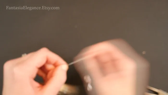 Secure the bead design: Repeat step 4 to secure the spirals.