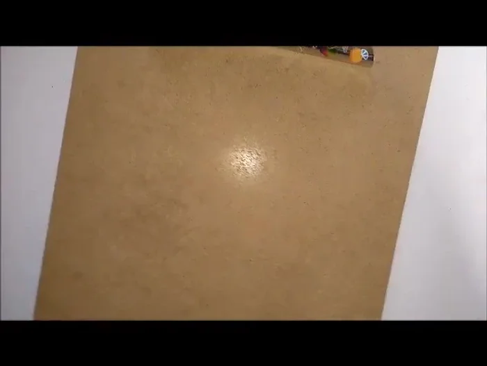 Arrange the two shorter ends on one side and the longest end on the other side of the board. Slightly separate the shorter ends and clip them to the bottom of the board.