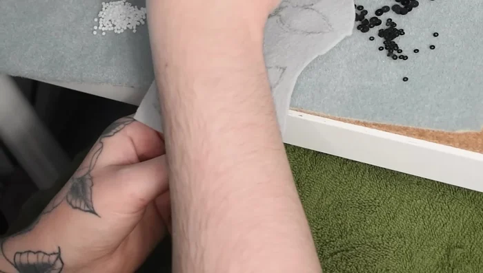 Continue beading, incorporating various bead types and colors to build the koi's body. Experiment with the arrangement for a natural look.