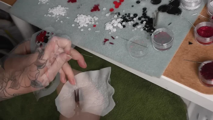 Cut around the edges of the felt, creating tabs to fold inward and stuff with scrap felt for volume.