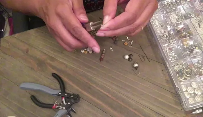 Connect the jump ring with the leaf charm to the bottom of the bead strand.