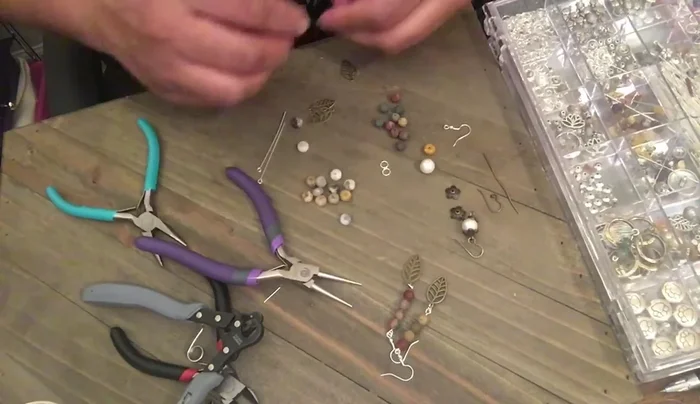 String agate beads and silver/hematite beads onto a head pin.