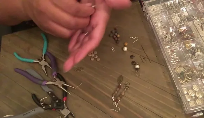 Connect the jump ring with the leaf charm to the bottom of the bead strand.