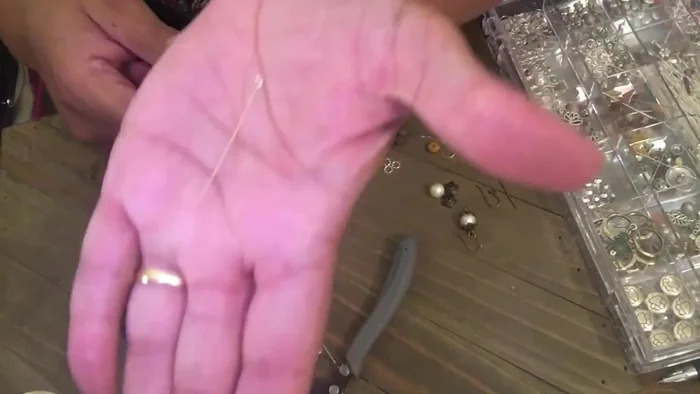 String four jasper beads onto the head pin.