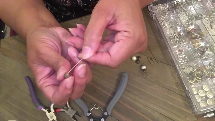 String four jasper beads onto the head pin.