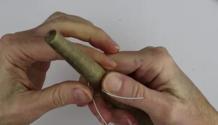 Use the ring cone to shape the wire into a ring. 