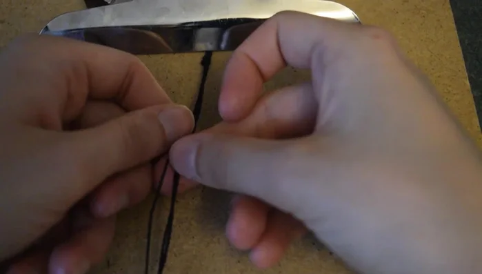 Begin tying square knots. Use the shortest cord as the core, and the two longer cords to create the knots. Alternate between left and right knots to prevent spiraling.