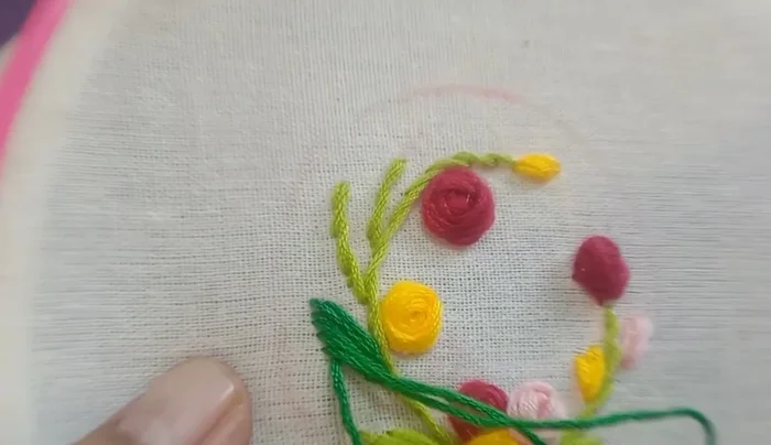 Add leaves using green and dark green thread.