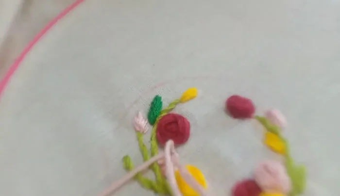 Add pink and red flower pistils to fill out the design.