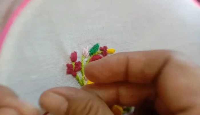 Measure and attach foam to the embroidered piece, securing it with rough stitches.