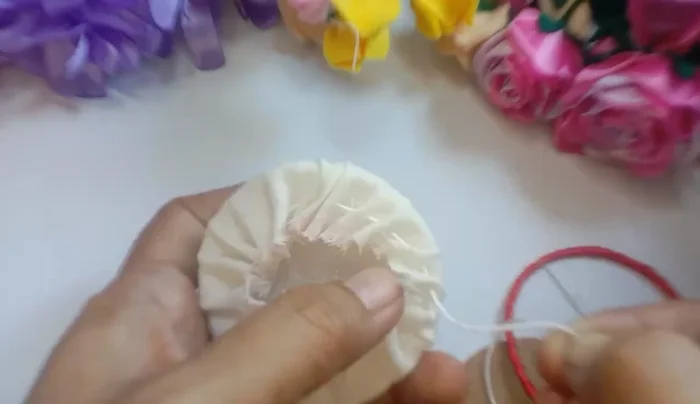 Cover the back with pinned flannel cloth and attach the ribbon-wrapped bracelet to the front.