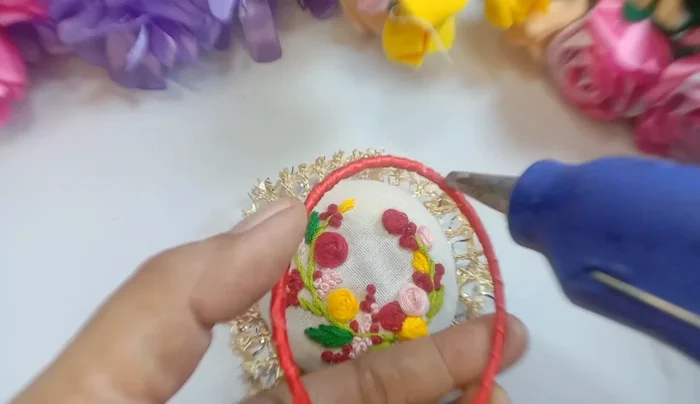 Cover the back with pinned flannel cloth and attach the ribbon-wrapped bracelet to the front.