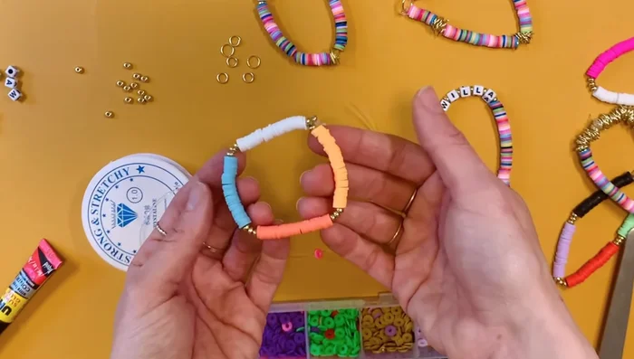 Separate color blocks with gold beads or jump rings.