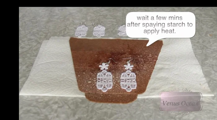 Lightly spritz the lace with heavy starch and iron to stiffen.