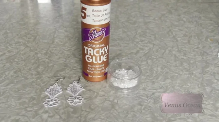 Add embellishments (pearls or other gems) using tacky glue (optional).