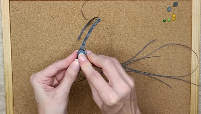 Insert the crystal into the created pouch and adjust its position.