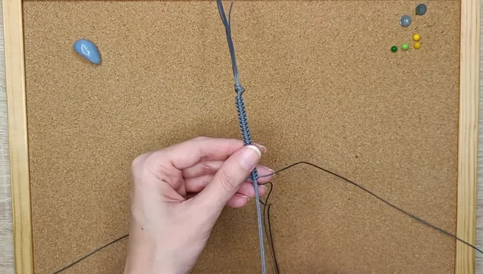 Insert the crystal into the created pouch and adjust its position.