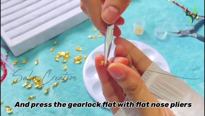 Pull the gear wire tightly and press the gear lock flat using flat nose pliers.