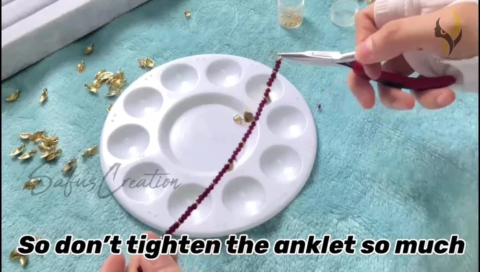 Pull the gear wire tightly (but slightly loose to avoid stiffness), press the gear lock flat, and cut the excess wire.