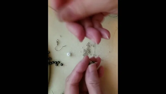 Add three size 11 seed beads, one hematite bead, and three more size 11 seed beads. Pass the thread through the hematite bead.